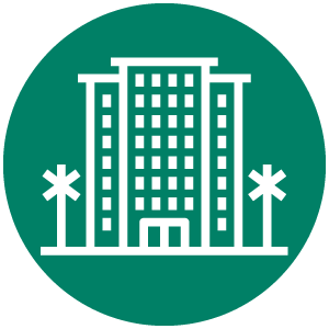 green circle with white icon of a hotel