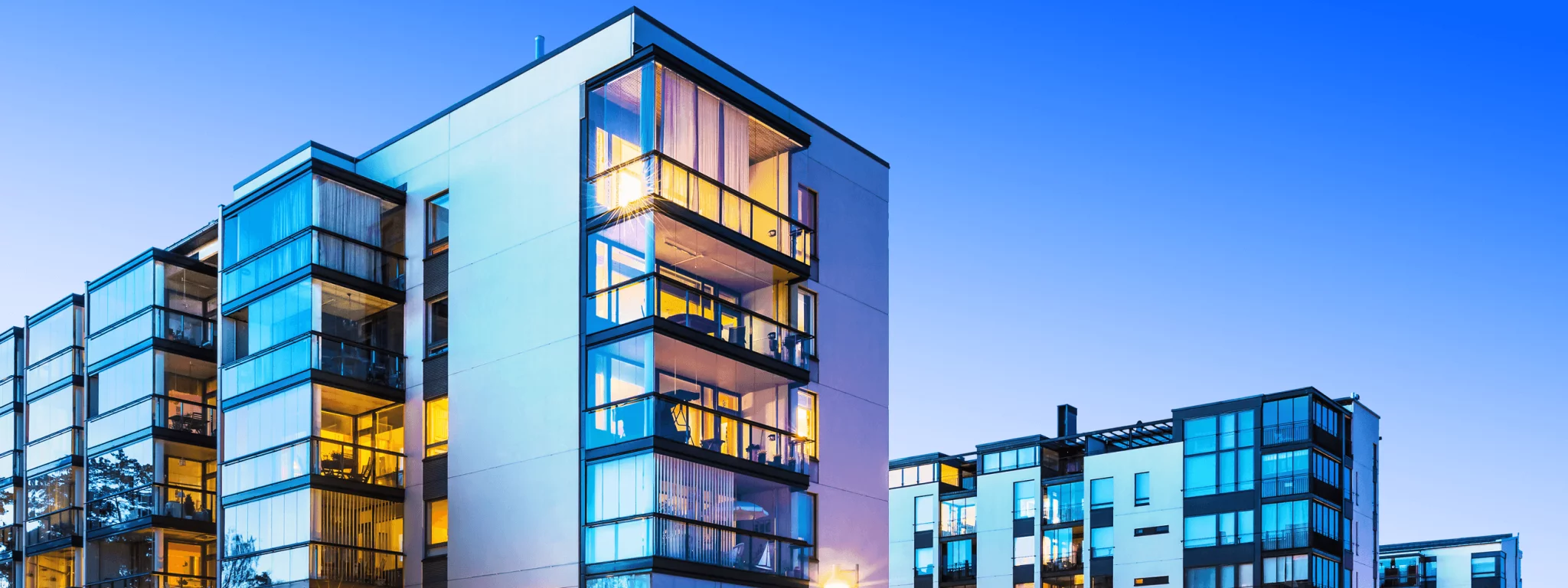 House building and city construction concept: evening outdoor urban view of modern real estate homes
